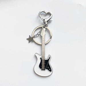 Retro Y2K guitar keychain with star charm and heart clasp in black and white enamel