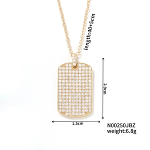 Detailed view of rectangle gold pendant with full crystal pavé and size measurements