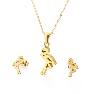 Golden flamingo jewelry set with hollow pendant necklace and stud earrings on white background