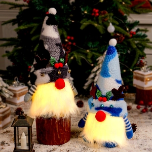 Christmas reindeer gnomes with LED light up noses and plush knit hats for holiday decor