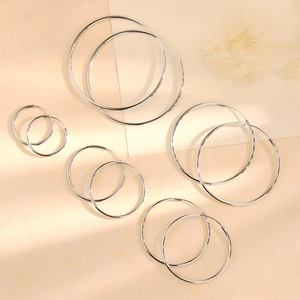 Classic silver hoops earrings set for women featuring five different polished circle sizes