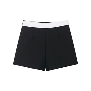 Detail of contrast high-waisted shorts with black body and white waistband design