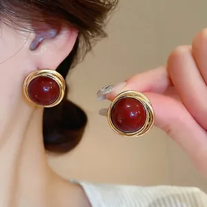 Vintage gold bird nest stud earrings with deep red round pearl for women's elegant fashion