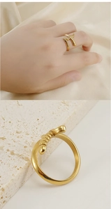 Detailed close-up and lifestyle view of 18K gold plated dagger sword hilt open ring