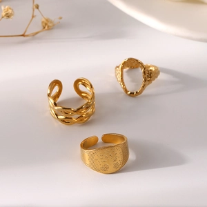 Three-piece set of elegant gold adjustable stainless steel rings with bohemian textures