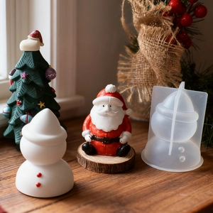 Detail of DIY Christmas snowman and Santa silicone mold with finished resin crafts