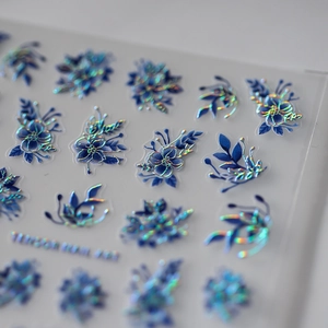Holographic blue floral nail art stickers with 3D embossed effect and laser rainbow finish