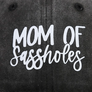 Close-up of MOM OF Sassholes printed text on vintage washed cotton baseball cap