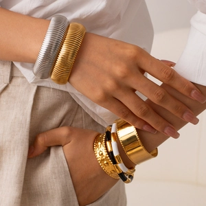 Stackable stainless steel embossed wide cuff bracelets in gold and silver finish