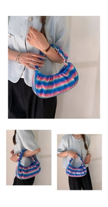 Detailed close-up and model display of a colorful gradient pleated cloud handbag