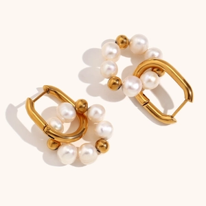 U-shaped stainless steel earrings with freshwater pearls and 18K gold plated finish