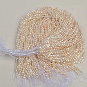 Strand of natural freshwater rice pearls in creamy white for handmade jewelry making