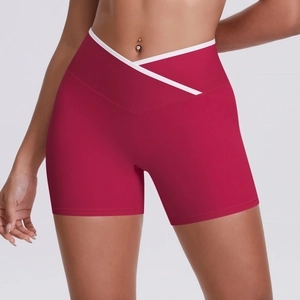 Close-up of high-waist yoga shorts featuring V-shaped crossover design with white trim