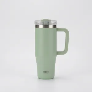 Close-up of mint green 40oz tumbler with ergonomic handle and clear lid design
