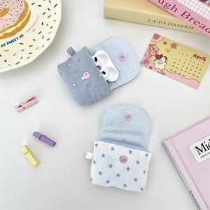 Detailed snap button closure of blue and white star pattern fabric earphone storage cases