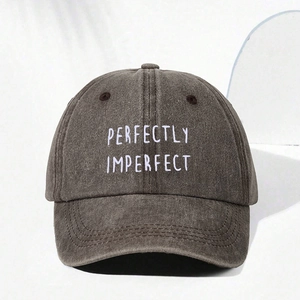 Detail of perfectly imperfect embroidery on washed cotton grey baseball cap