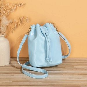 Minimalist light blue PU leather bucket bag with gold hardware and drawstring closure