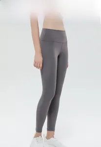 Detail view of high-waisted dark grey yoga leggings with seamless peach lift effect