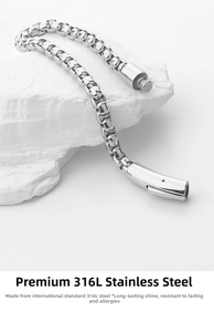Detail of 316L stainless steel Cuban chain link bracelet with secure clasp on white stone