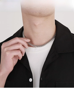 Polished silver stainless steel Cuban curb chain necklace styled on male model
