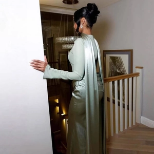 Elegant sage green long sleeve satin evening dress with pleated back scarf detail