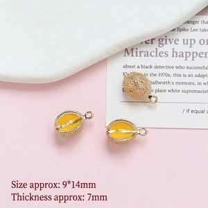 Close-up of three 9x14mm gold-plated durian fruit pendants for DIY jewelry making