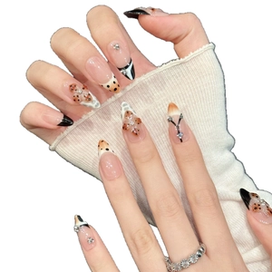 Pink nude press-on nails with leopard print, black French tips and tiny rhinestones