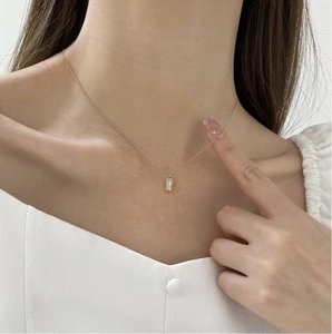 Minimalist gold stainless steel necklace with a green emerald cut zircon pendant for women