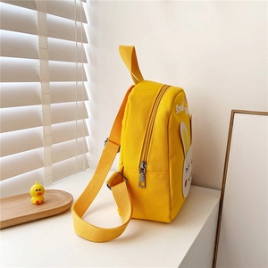 Cute yellow canvas backpack for toddlers with cartoon rabbit ear design and 3D details
