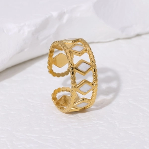 Detailed close-up of 18K gold plated ring with white geometric rhombus enamel inlays