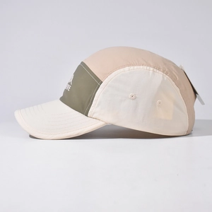 Detail of five-panel camping cap with multi-color stitching and embroidery