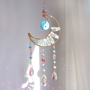 Handmade gold moon suncatcher with blue evil eye beads and crystal rainbow prisms