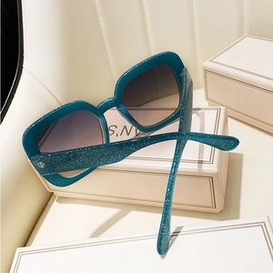 Peacock blue oversized square sunglasses with sparkling glitter finish and gradient lenses