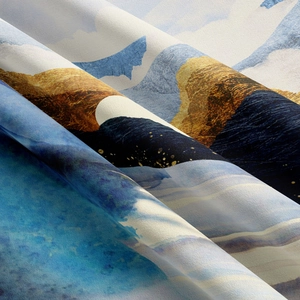 Close-up of abstract mountain landscape tapestry fabric with sky blue and golden brown print