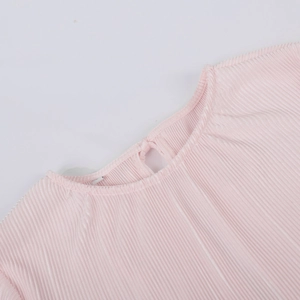 Detail of pink pleated blouse collar with keyhole back and button closure