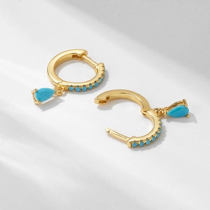 Detailed macro view showing the 925 silver hallmark on luxury gold-plated turquoise earrings