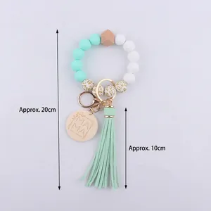 Silicone bead wristlet keychain with MAMA wood charm, leopard print beads, and mint tassel