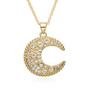 Macro shot of gold celestial moon necklace featuring micro-set zircon stones on white background