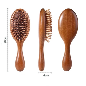 Front, side and back views of a 20cm sandalwood hair cushion brush with wooden bristles