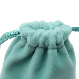 Mint green velvet drawstring jewelry pouch for soft storage of rings and earrings