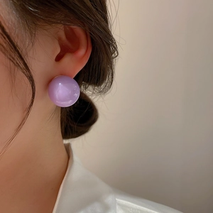 Minimalist purple acrylic round ball stud earrings worn by female model for a sweet look