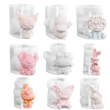 Detailed view of nine assorted 3D silicone molds for DIY candles and resin crafts