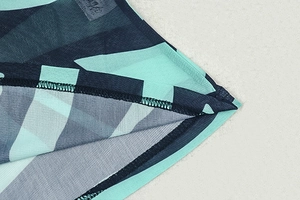 Macro shot of mint green and navy geometric striped breathable mesh fabric stitching