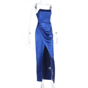 Macro detail of royal blue satin evening dress featuring high slit and pleated waist design