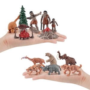 Prehistoric caveman life and ancient animal figurines set with mammoth and saber-toothed tiger