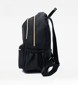 Side view of black oxford backpack showing dual golden zippers and side elastic pocket