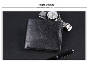 Close-up of black leather men's wallet with refined grain beside a watch and pen