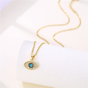 Gold stainless steel evil eye pendant necklace with blue stones and clear crystals