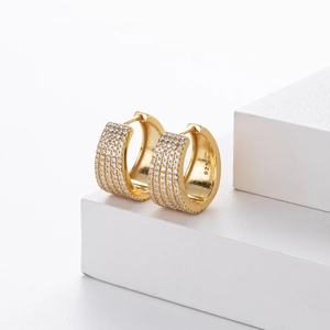 Close-up of gold S925 sterling silver U-shaped hoop earrings with micro-set zircons