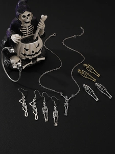 Macro shot of Gothic skull jewelry set including necklace and bracelet on dark leather